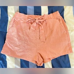 Soft pink colored shorts.